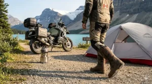 A rider walking comfortably in ADV boots near a Canadian campsite, showing flexibility for long distance trips.