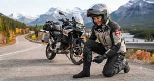 Cross-section illustration showing slim heated insoles sliding comfortably into tight-fitting leather motorcycle riding boots.