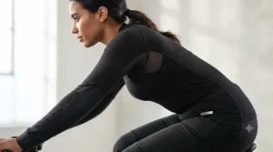 Diagram showing sweat evaporating away from the skin through a technical synthetic base layer during an active motorcycle ride.