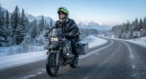 Motorcyclist navigating a highway during a Canadian winter road trip while wearing insulated cold-weather gear.