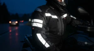 Detailed view of retro-reflective stripes on a motorcycle jacket designed for enhanced nighttime visibility across Canadian roads.