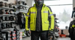 Illustration demonstrating how a hi-vis rain jacket fits comfortably over bulky motorcycle riding gear.